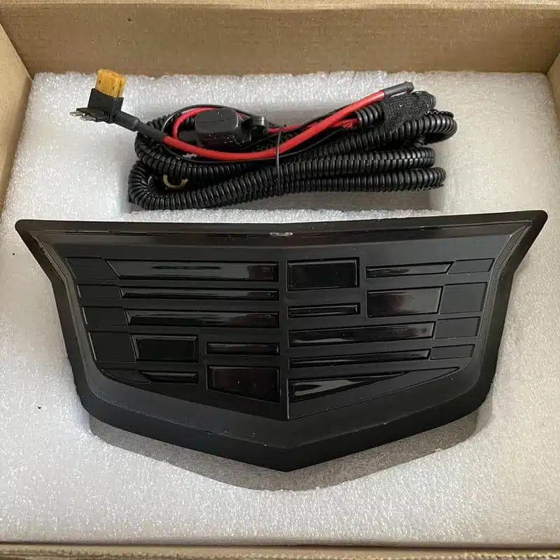 Cadillac CT5 LED emblem — black finish, multicolor, front angle