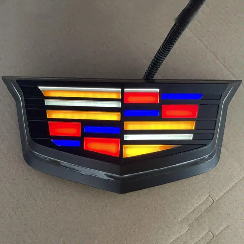 Custom waterproof multi-color RGB LED front logo badge designed for Cadillac XT4 grilles.
