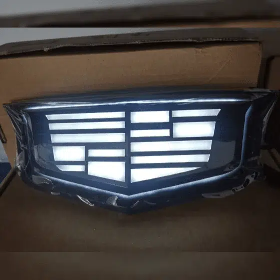 Cadillac XT5 illuminated emblem — silver finish, white LED, front