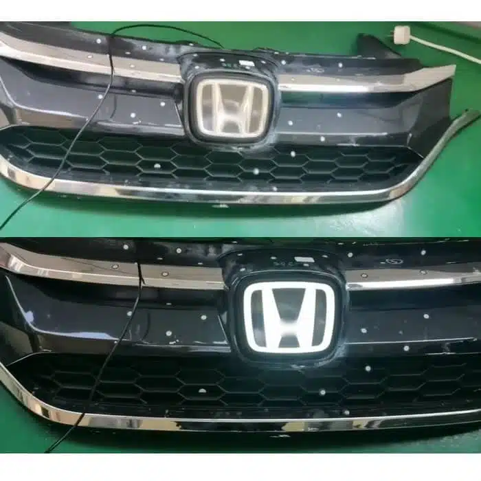 Honda Civic LED emblem — silver finish, installed on grille