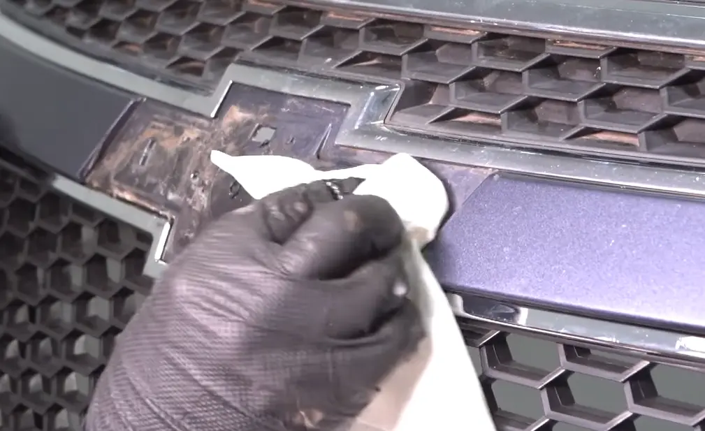 Clean the emblem surface